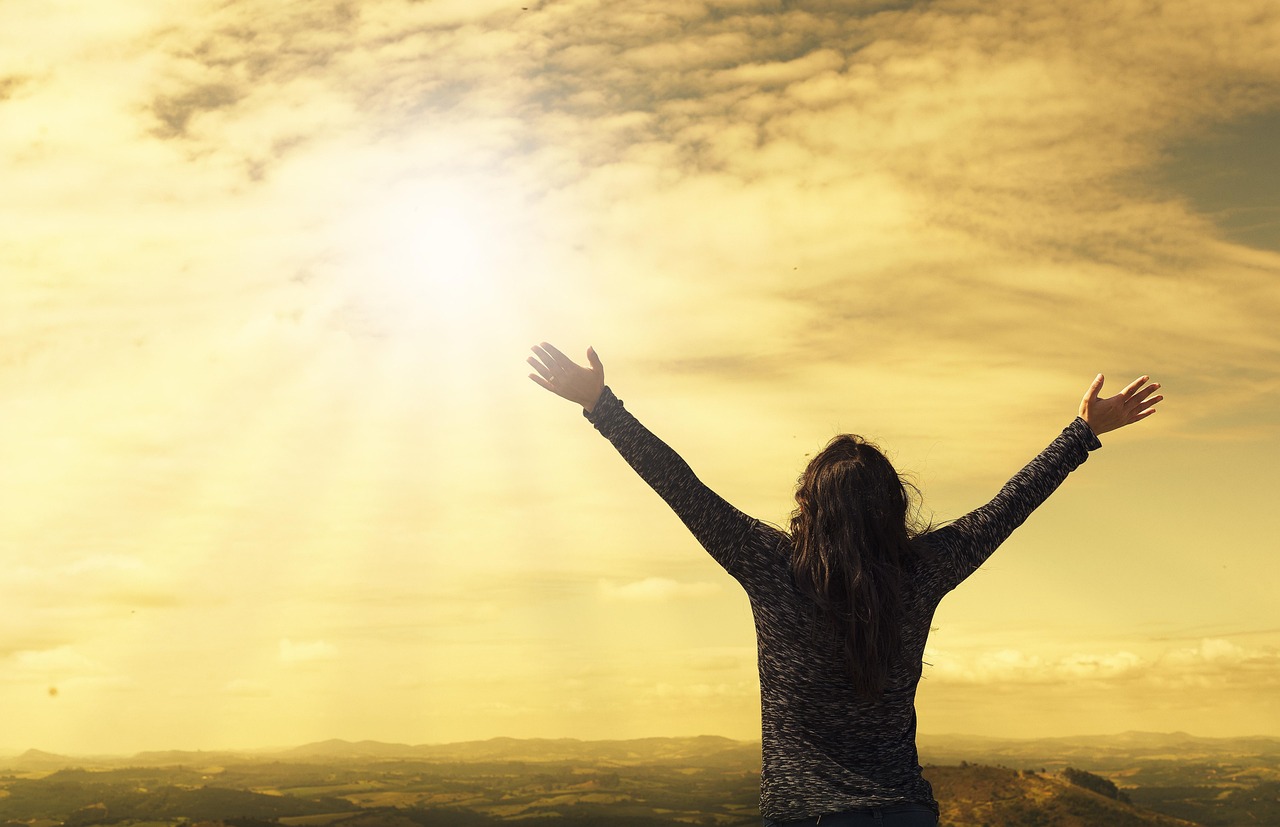 woman, sky, nature, sunlight, arms, open arms, sunbeams, sunrays, clouds, worship, freedom, happiness, relieved, prayer, praise, success, joy